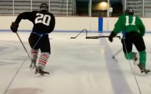 2 hockey players raptor training on ice